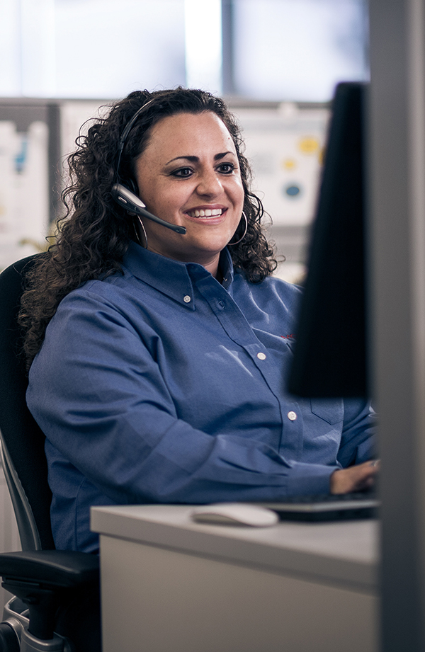 woman at desk on computer